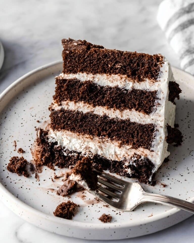 Decadent Brownie Cake with Vanilla Cream Cheese Frosting and Chocolate Swirls Recipe