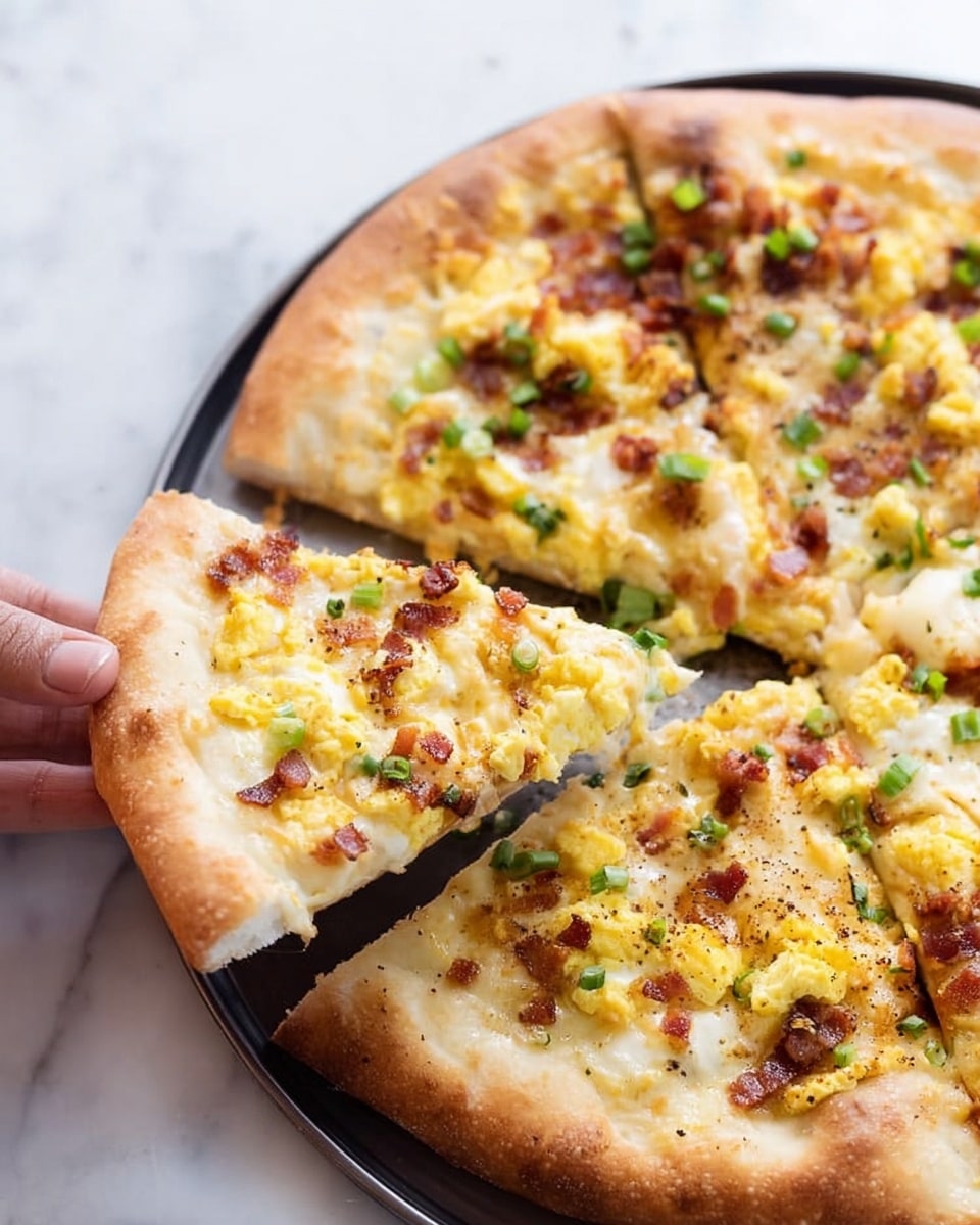 A close-up top view of a round breakfast pizza with a golden, slightly thick crust at the base, topped with a layer of melted white and light orange cheese. Above the cheese are scattered scrambled eggs in bright yellow, mixed with small brown bits of bacon, and tiny green chopped scallions spread evenly. The pizza sits on a dark round pan, placed on a white marbled surface. Nearby are small white bowls filled with chopped green scallions and shredded white cheese, and a soft beige-striped cloth is casually placed at the bottom left corner. photo taken with an iphone --ar 4:5 --v 7