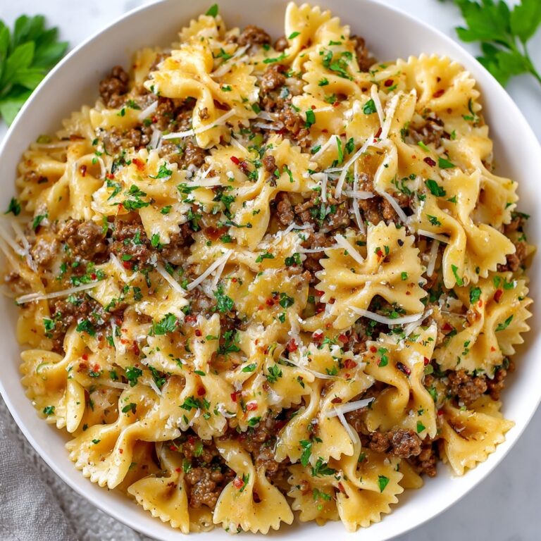 Cheesy Bowtie Pasta with Savory Cajun Ground Beef in Garlic Cream Recipe